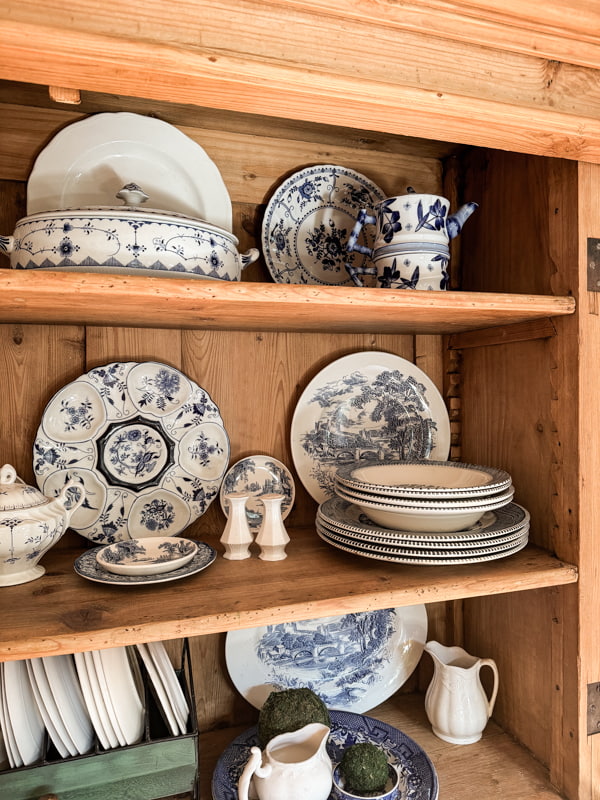 How to style shelves with blue and white dishes.  
