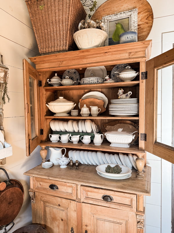Kitchen Cabinet Shelf styling with Vintage Ironstone Dishes and pig breadboards.  