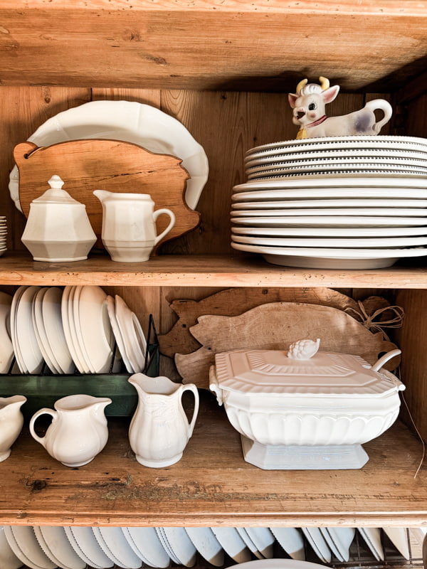 Decorating shelves with vintage ironstone dishes.  