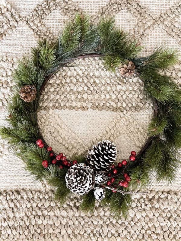 Combine a thrift store wreath with a smaller wreath for more impact.  Repurposed Christmas Decorating.