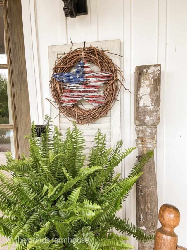 DIY Twig Star Patriotic Wreath on front porch.  
