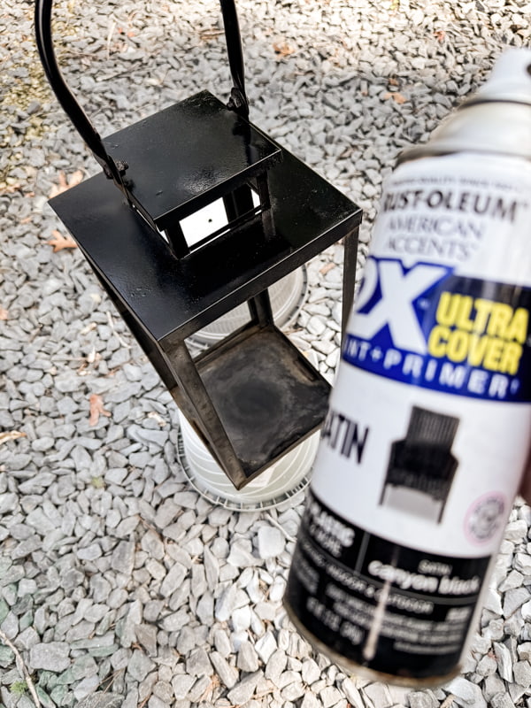Use black spray paint to update broken lantern.