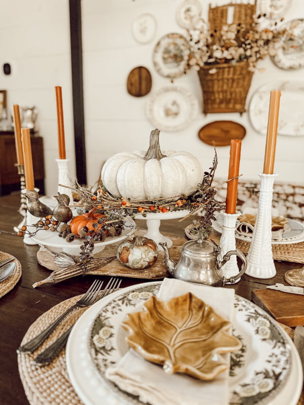 Vintage dishes for fall with brown transferware and fall leaf plate.  Vintage Milk glass centerpiece with pumpkins. 