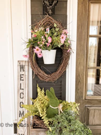 Farmhouse Porch Ideas for Spring with faux flowers and greenery