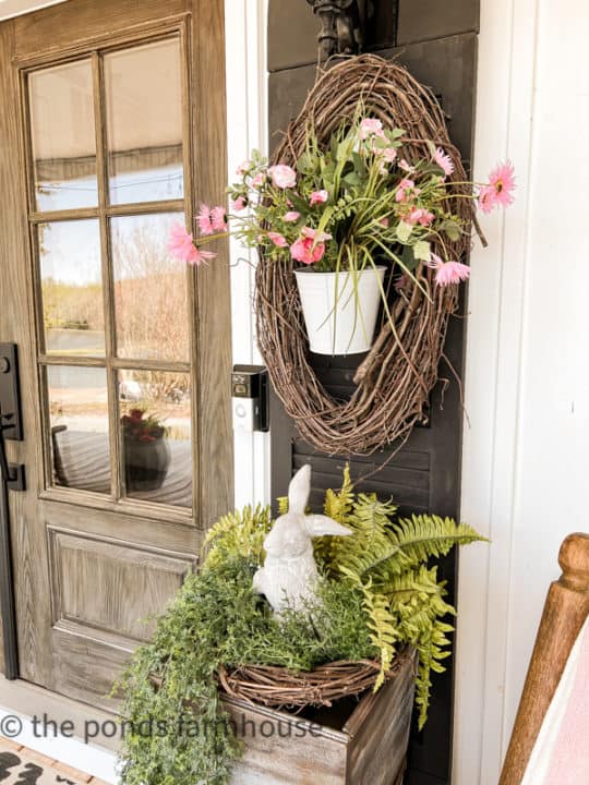 Farmhouse Porch Ideas for Spring with faux flowers and greenery