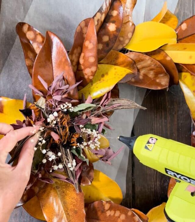 cropped-Fall-Magnolia-Leaf-Wreath-Adding-dried-flowers-to-Preserved-Leaves.jpg