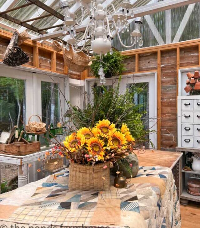 cropped-Vintage-Quilt-and-Repurposed-Chandelier-withSunflower-Basket-with-Ferns-in-Greenhouse.jpg