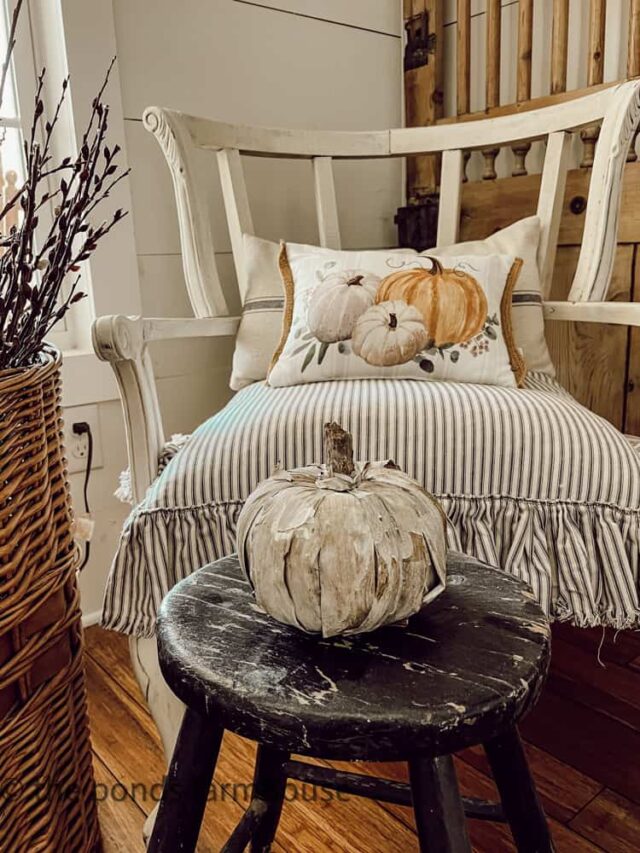 Dollar Tree pumpkin covered in corn husk displayed in farmhouse.