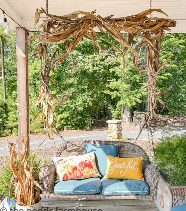 cropped-porch-swing-decorated-for-fall-with-corn-stalks-garland.jpg