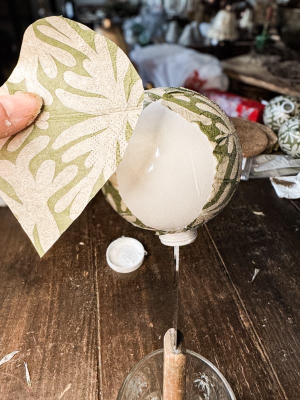 Apply napkins to ornaments in small sections