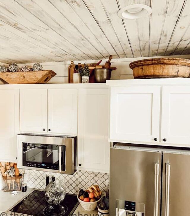 cropped-wooden-bowls-and-crocks-above-kitchen-cabinets-1.jpg