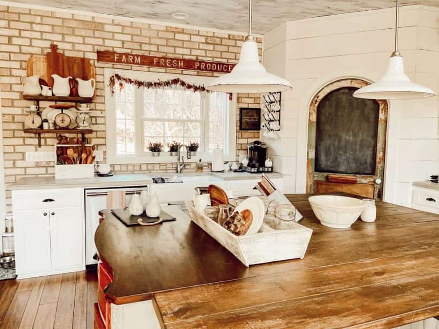 https://www.thepondsfarmhouse.com/wp-content/uploads/2023/03/Farmhouse-Kitchen-with-DIY-Island-from-Repurposed-Furniture.jpg
