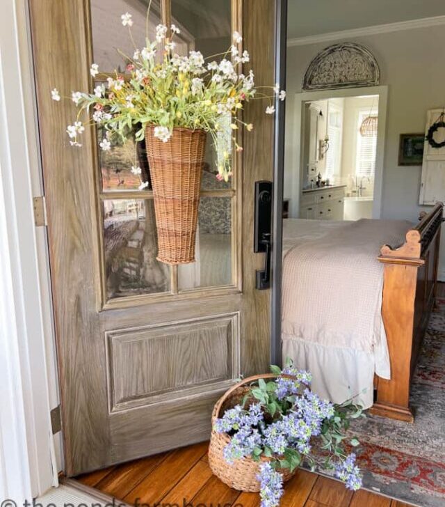 cropped-Close-up-of-door-with-baskets-and-flowers-in-bedroom.jpg