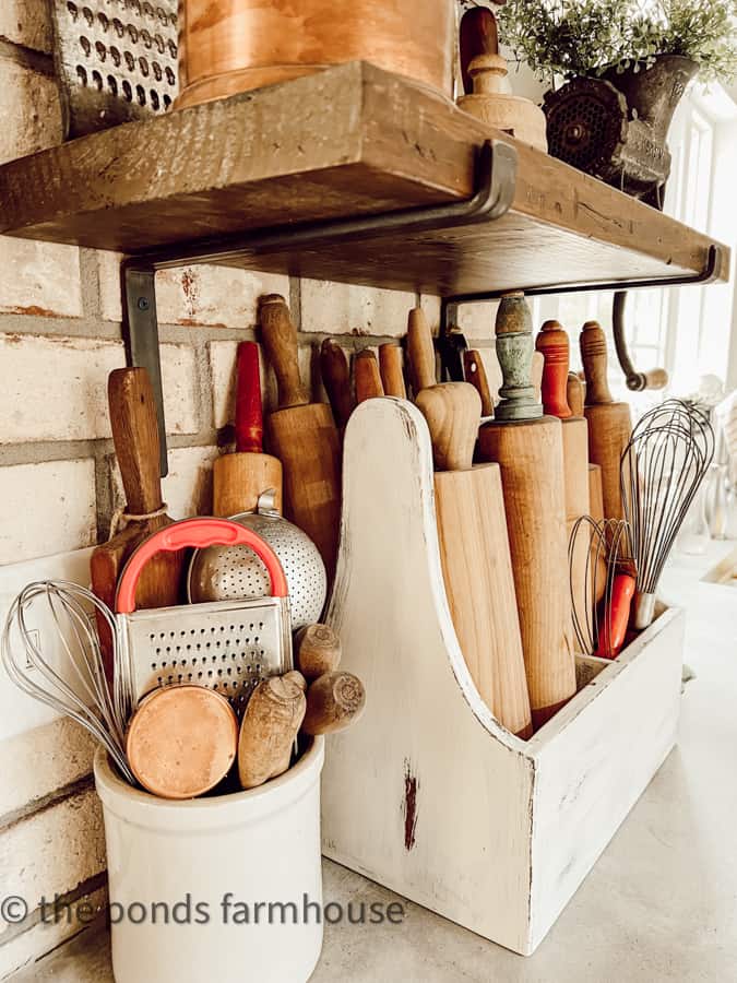https://www.thepondsfarmhouse.com/wp-content/uploads/2023/05/crock-filled-with-vintage-kitchen-utensils.jpg