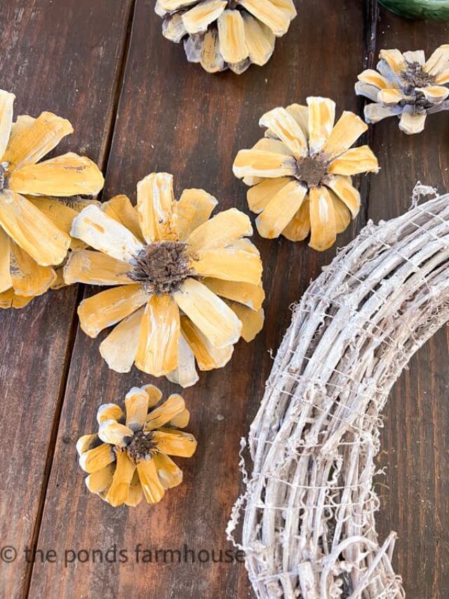 Pinecone Sunflower Wreath with painted pinecones and white grapevine wreath