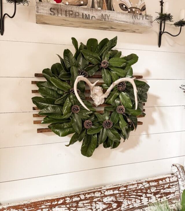 cropped-Antler-and-Magnolia-and-Pinecone-wreath-hanging-on-dining-room-wall-3.jpg