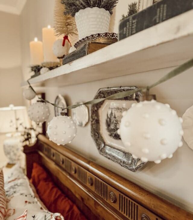 cropped-Hobnail-Milk-Glass-Ornament-garland-on-shelf-above-bed-1.jpg