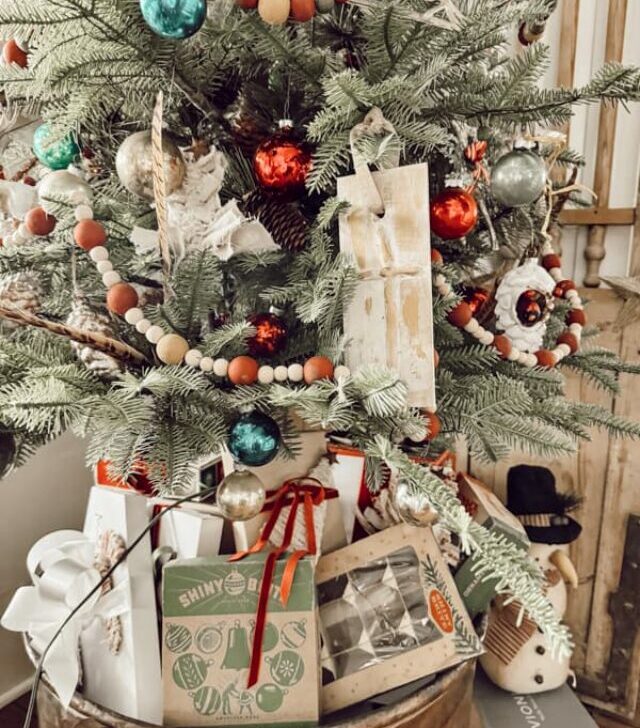 cropped-tree-with-shiny-brite-boxes-under-the-tree.jpg