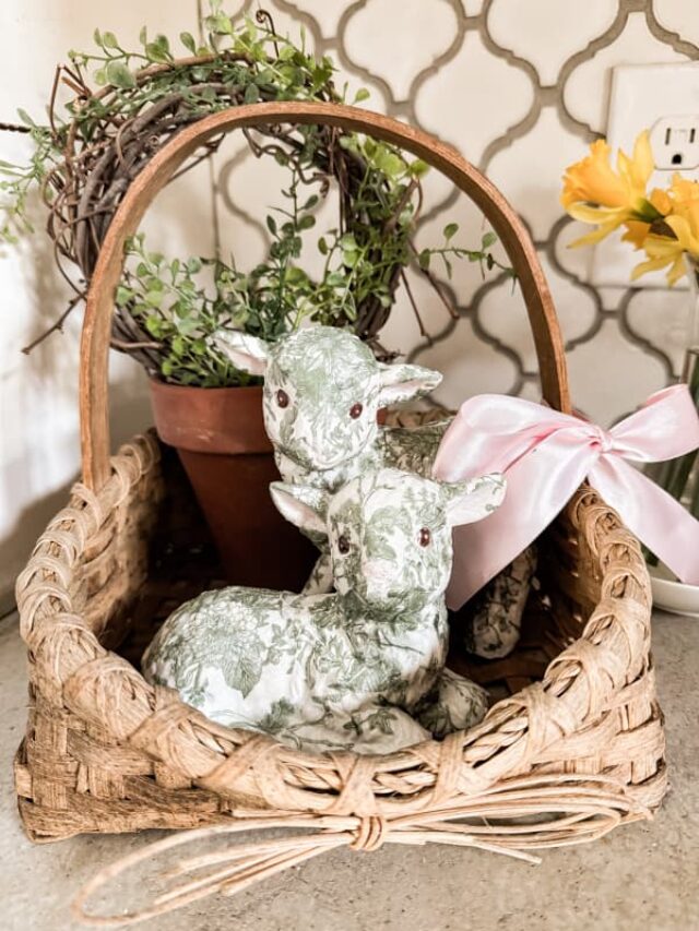Thrift store lambs with napkin decoupage. in basket with grapevine topiary.