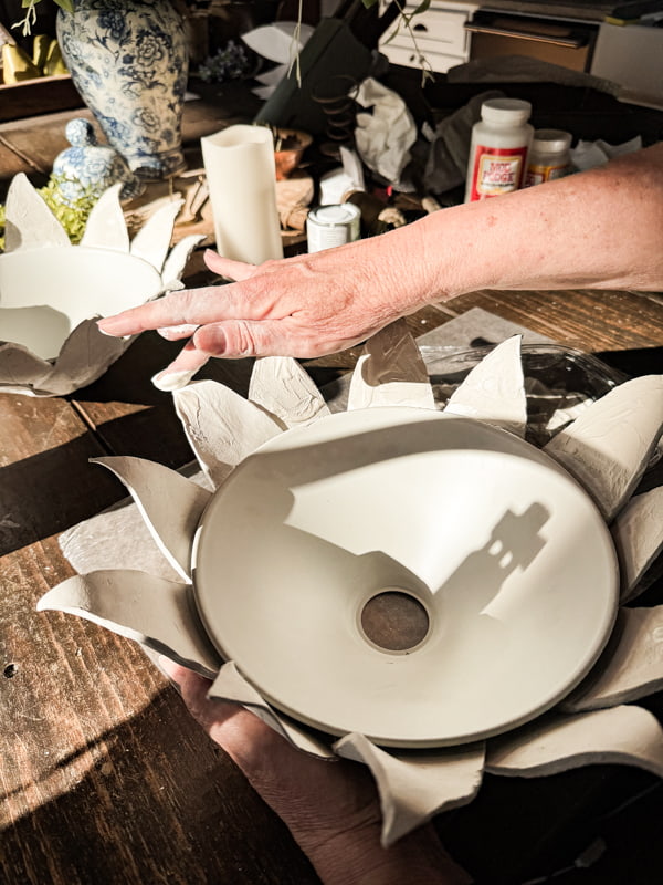 add Plaster of Paris to tips of flower lampshade.