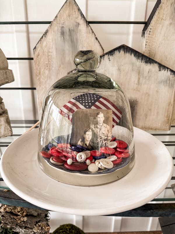 Red, White & Blue buttons under glass with American flag for Memorial Day tribute. 