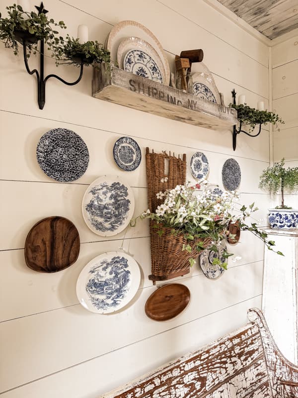 Unique plate wall display using vintage thrifted plates and vintage basket.