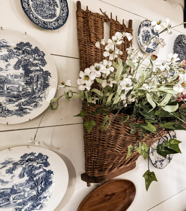 cropped-vintage-grape-hod-gathering-basket-on-wall-with-vintage-plates-1.jpg