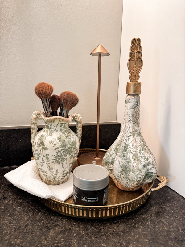 add Magnolia Market Vases to brass tray on bathroom countertop with makeup brushes.  