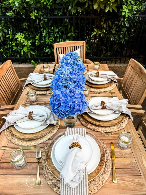 Rustic outdoor Table with blue hydrangeas.  