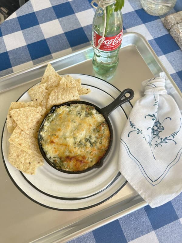 Artichoke and Spinach Dip in a skillet for easy smoker recipe.