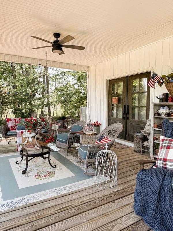 Front porch seating area decorated for 4th of July