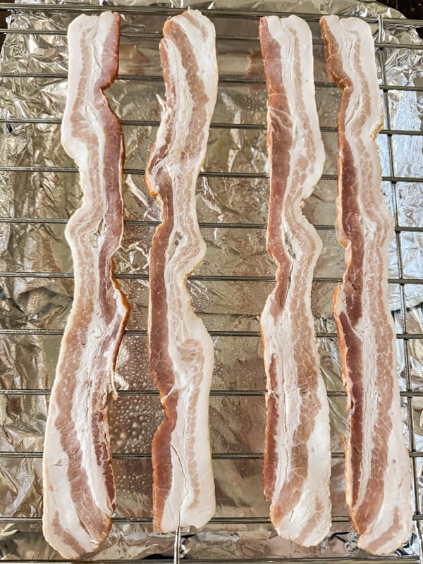 Add bacon strips to wire rack.