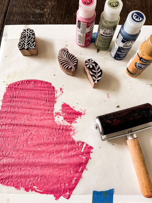 Supplies for DIY Napkins with paint, roller and stamps