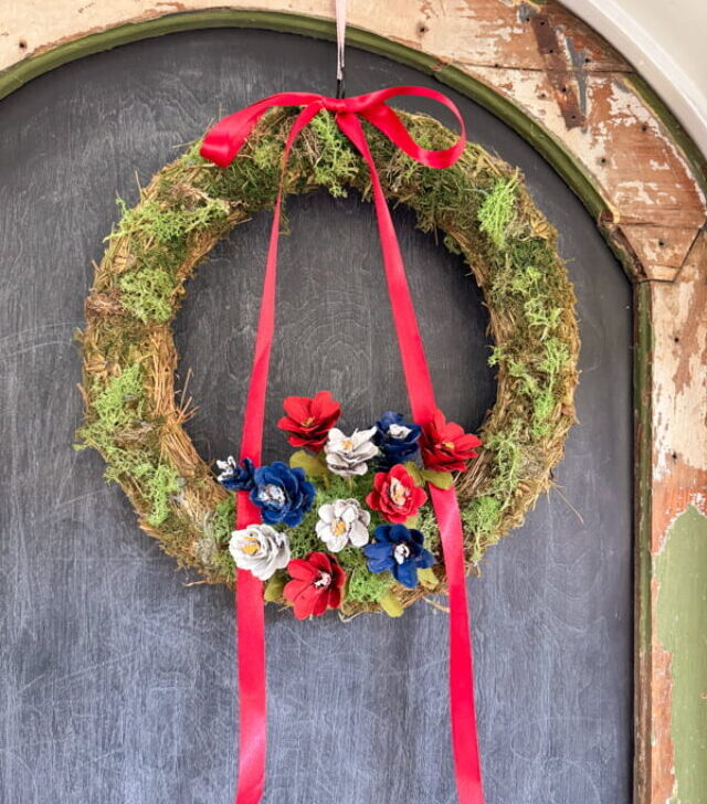 cropped-red-white-and-blue-pinecone-flowers-moss-wreath-Summer-Pinecone-Wreath.jpg