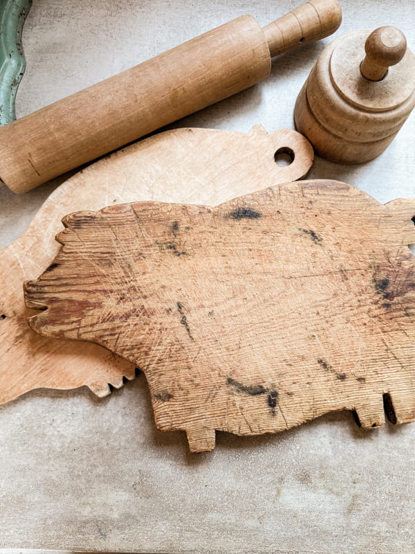 Rustic Vintage Pig Cutting Board with scorch marks from a hot pot and knife marks.  