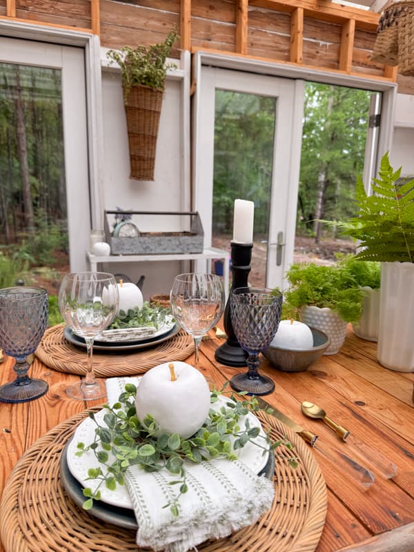 Woven plate chargers with blues and greens for summer tablescape.