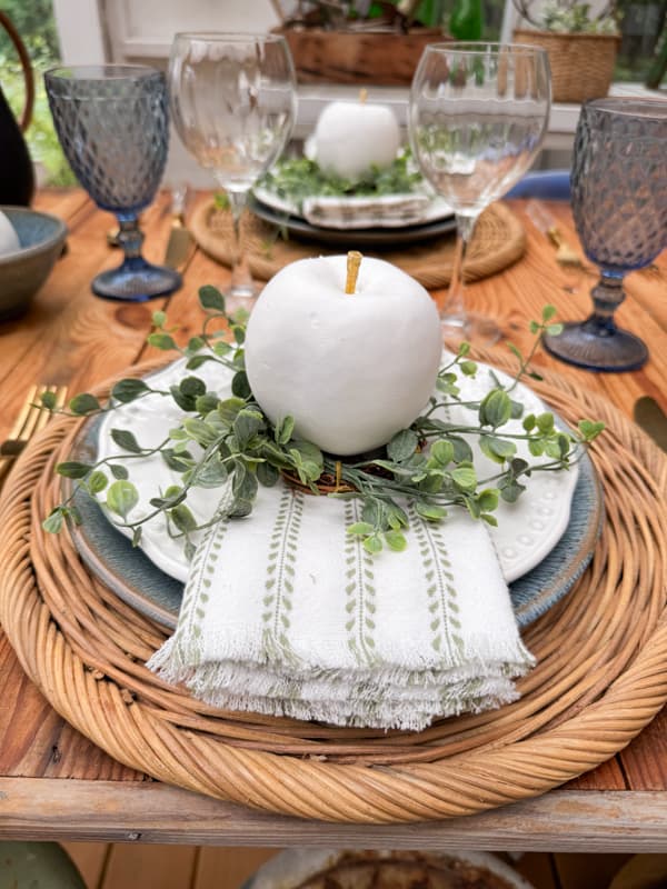 Easy Apple Decor before and after with white paint and gold stem on blue plates and greenery.  