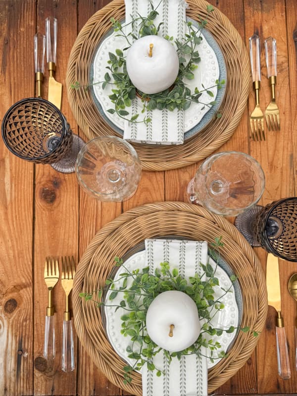 Summer tablescape. vintage silverware, wicker plate chargers 