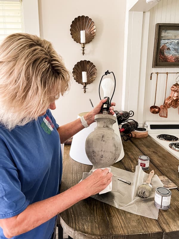 Add wax to seal and protect the finish on the refreshed coastal lamp.