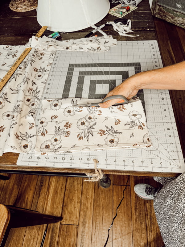 Cut fabric to make a pleated fabric lampshade.