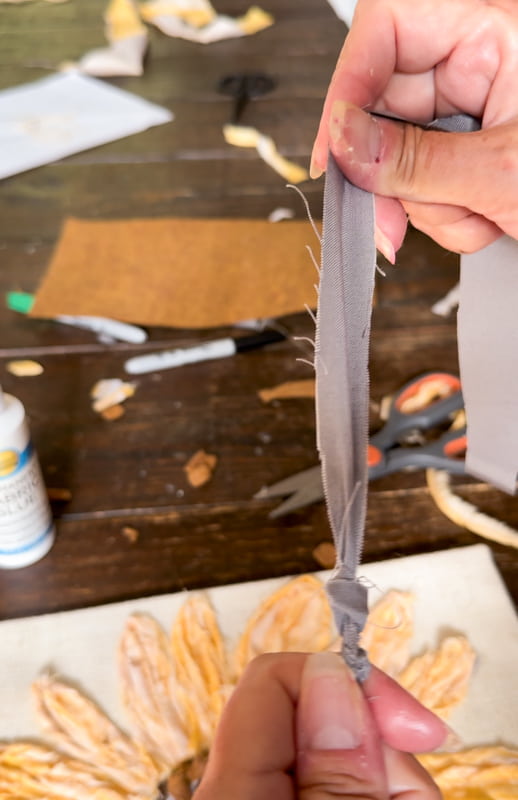 Recycle scrap fabric and tie into knots to create centers of the sunflowers.