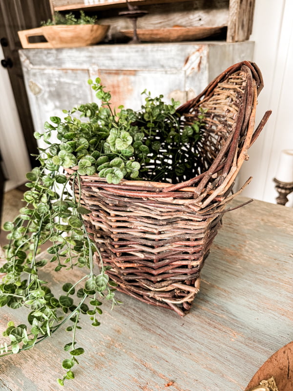 thrift store wall basket with greenery 