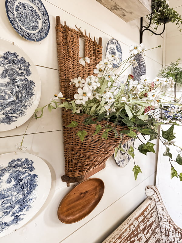 Vintage Grape Hod gathering basket makes great wall basket mixed with blue and white plates for dining room wall.