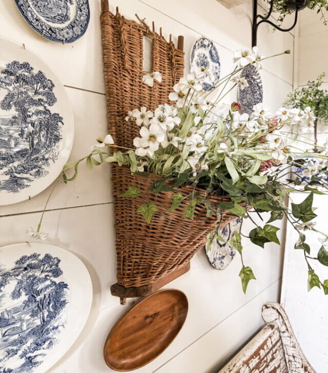 cropped-Wall-Basket-with-faux-flowers-and-blue-and-white-plate-wall.jpg
