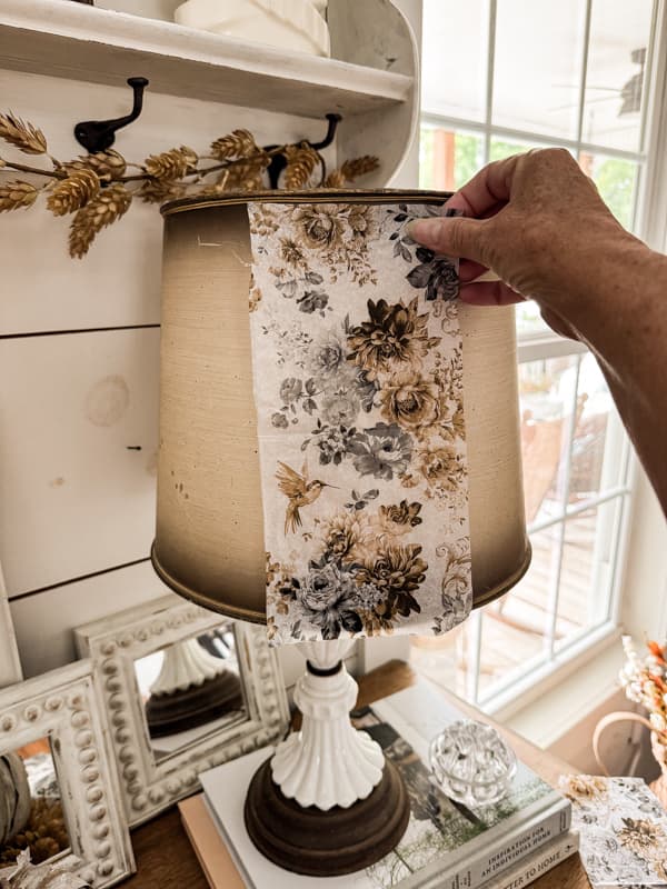 Add napkin to lampshade for a custom lamp makeover with napkin decoupage ideas