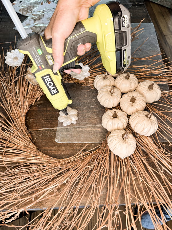 Add burlap flower stickers with hot glue to make DIY Fall Wreath