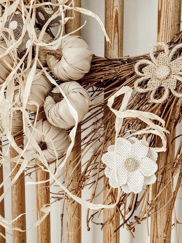 Burlap flowers and beige pumpkins for a Dollar Tree Pumpkin Wreath