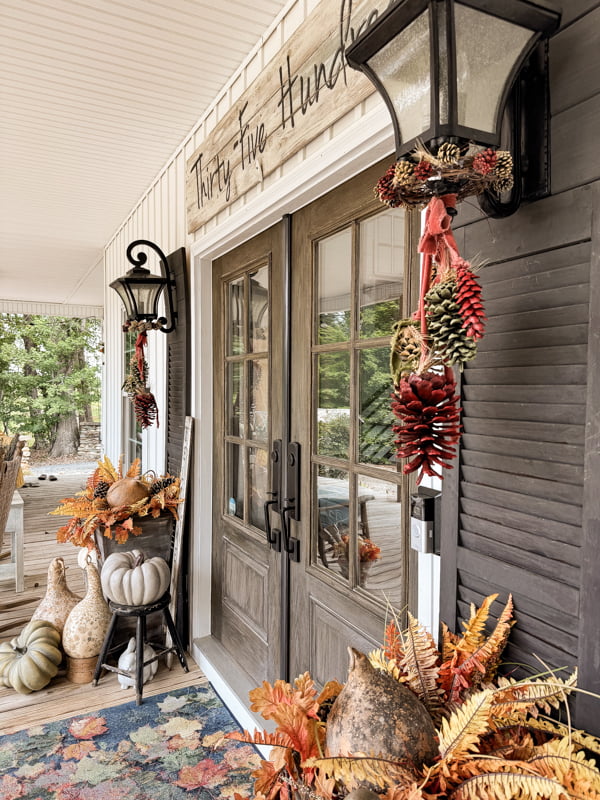 DIY pinecone swgs for fall porch decorations.  