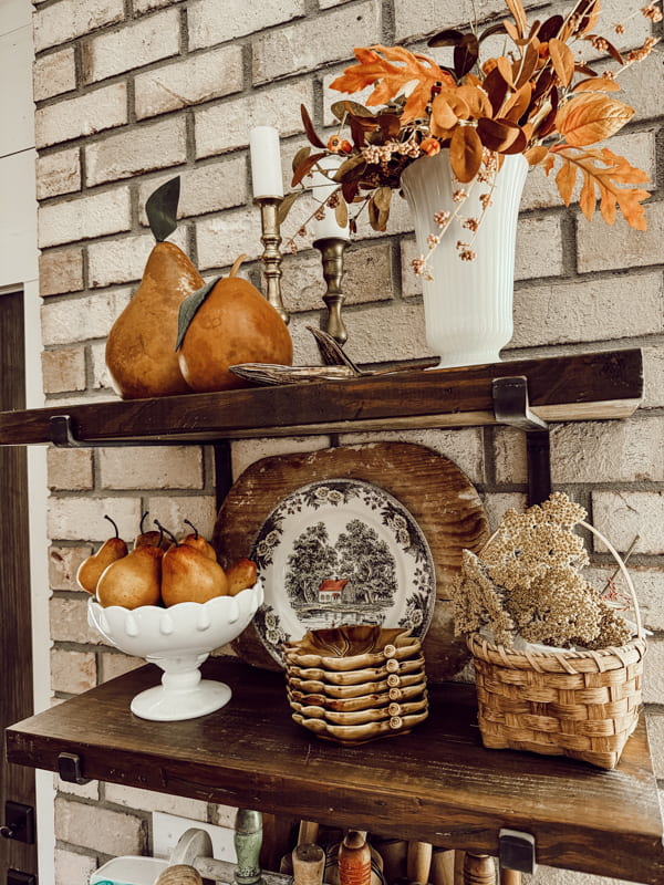 Open kitchen shelves with vintage milk glass decor for fall decorating with fall stems and pears.  