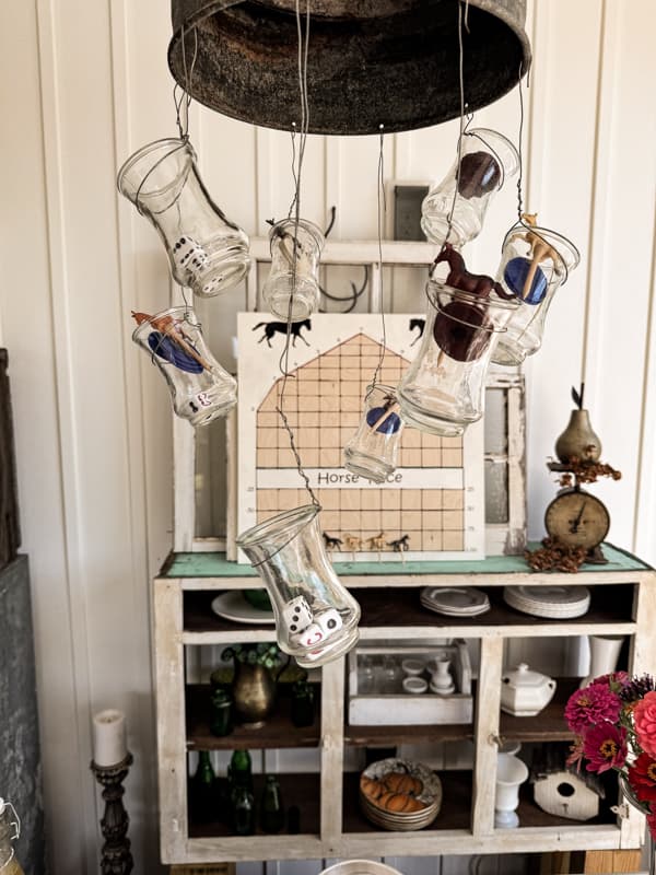 Dice and poker chips hang from the vases on the light fixture.